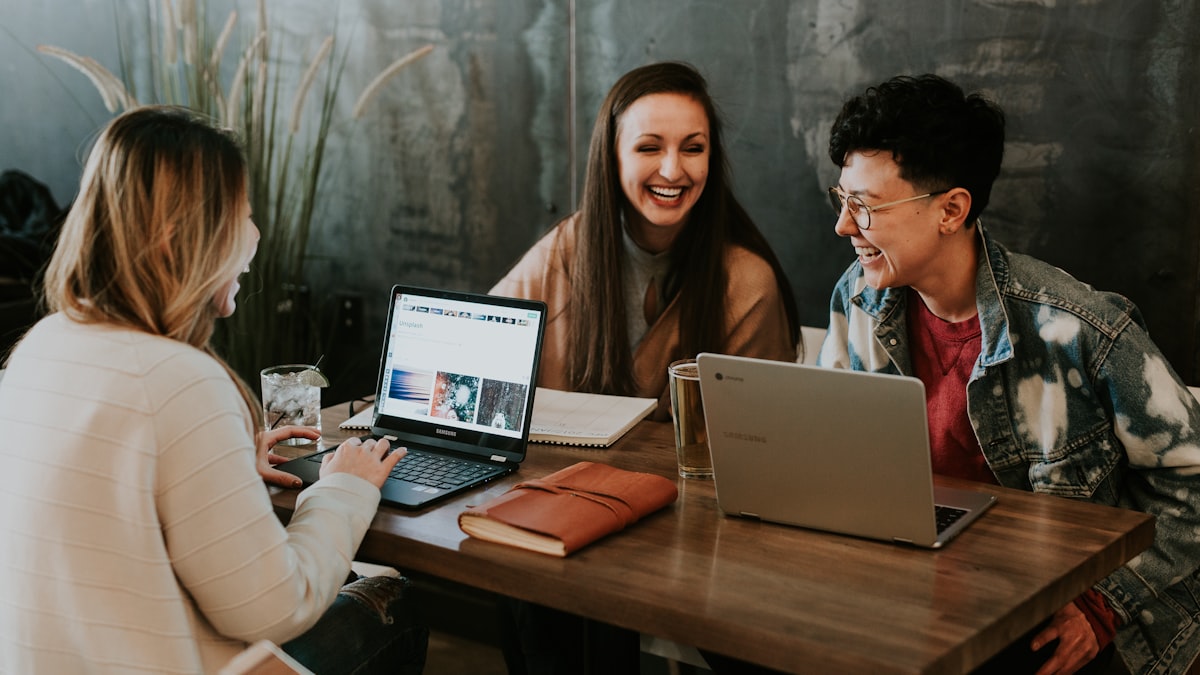 Interns collaborating at a tech office